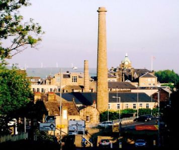 View across Burnley, with two of the few remaining mill chimneys