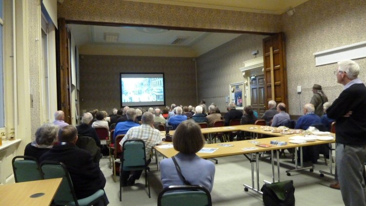 The audience awaiting the presentation
